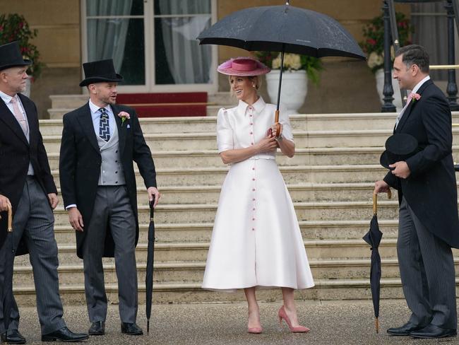 Zara Tindall, centre, and Mike Tindall, left, arrive at the Sovereign's Garden Party at Buckingham Palace on May 21, 2024. Picture: Getty Images