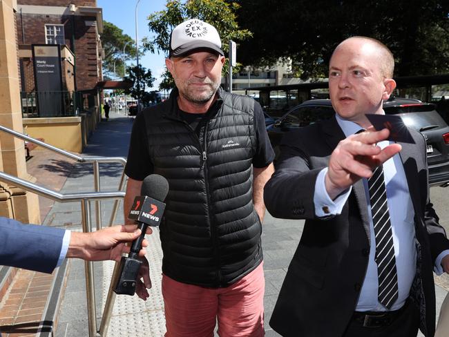 Michael Slater, with his solicitor James McLoughlin, leaving Manly Police Station in October, 2021. Picture: Richard Dobson