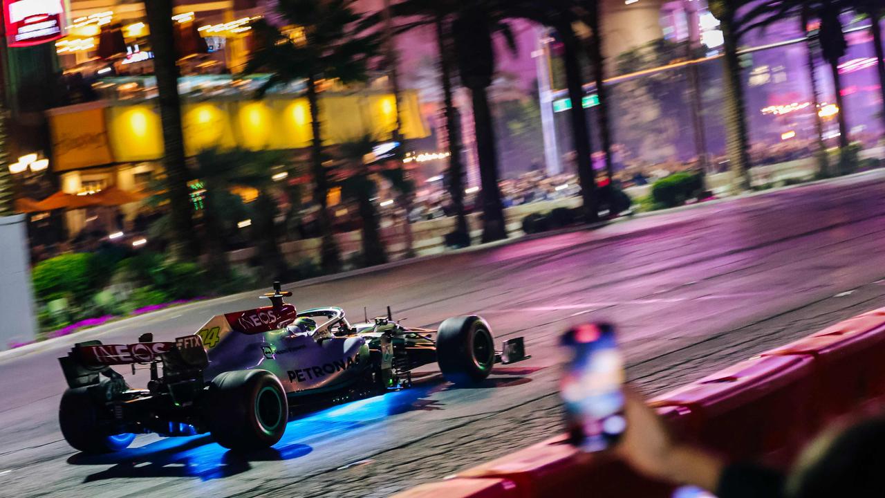 A Formula 1 racing team car from Mercedes-AMG Petronas makes a live run on the Las Vegas Strip during the Las Vegas Grand Prix Launch Party, ahead of the 2023 Inaugural Las Vegas Grand Prix, at Caesars Palace, in Las Vegas, Nevada, on November 5, 2022. - The inaugural Las Vegas F1 Grand Prix will take place November 16-18, 2023. (Photo by WADE VANDERVORT / AFP)