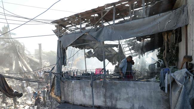 A man inspects the debris a day after an Israeli airstrike in Beirut's southern suburb of Jnah. Picture: AFP