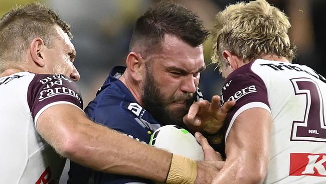 TOWNSVILLE, AUSTRALIA - JULY 06: Kyle Feldt of the Cowboys is tackled during the round 18 NRL match between North Queensland Cowboys and Manly Sea Eagles at Qld Country Bank Stadium, on July 06, 2024, in Townsville, Australia. (Photo by Ian Hitchcock/Getty Images)