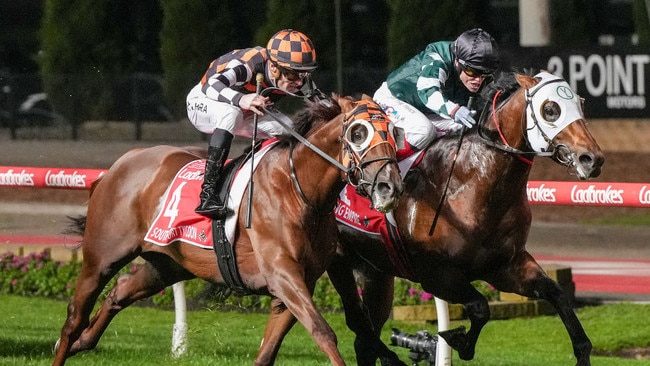 Southport Tycoon (orange) grabs Growing Empire in the shadows of the post to win the Manikato Stakes at The Valley on Friday. Photo: George Salpigtidis/Getty Images.