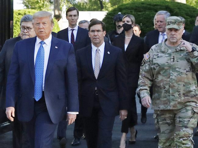 FILE - In this June 1, 2020 file photo, President Donald Trump departs the White House to visit outside St. John's Church, in Washington. Part of the church was set on fire during protests on Sunday night. Walking behind Trump from left are, Attorney General William Barr, Secretary of Defense Mark Esper and Gen. Mark Milley, chairman of the Joint Chiefs of Staff.  Milley says his presence Ã¢â¬Åcreated a perception of the military involved in domestic politics.Ã¢â¬Â He called it Ã¢â¬Åa mistakeÃ¢â¬Â that he has learned from.  (AP Photo/Patrick Semansky)
