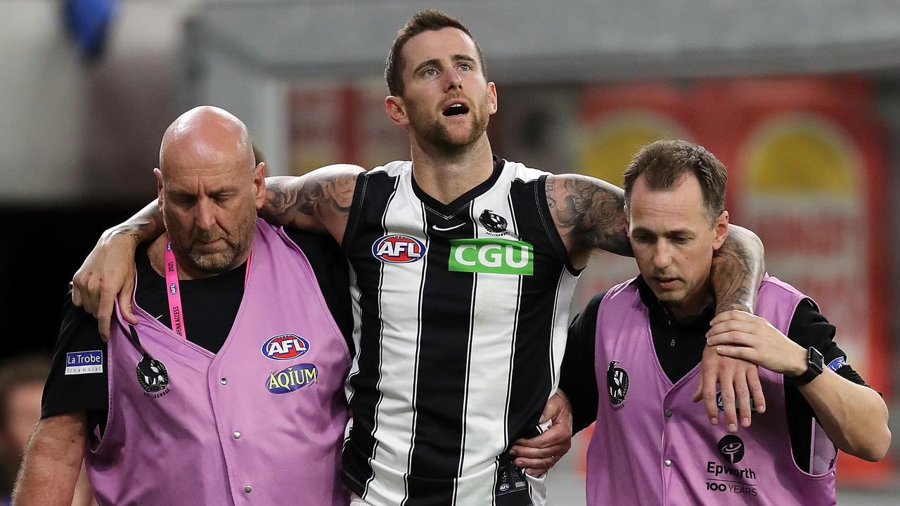 Trainers helped Howe from the field during Collingwood’s round five loss. (Photo by Will Russell/AFL Photos via Getty Images)