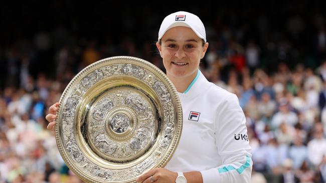 MARCH 23, 2022: World number 1 and three-time Grand Slam winner Ash Barty has announced her retirement from tennis at the age of 25. LONDON, ENGLAND - JULY 10: Ashleigh Barty of Australia celebrates with the Venus Rosewater Dish trophy after winning her Ladies' Singles Final match against Karolina Pliskova of The Czech Republic on Day Twelve of The Championships - Wimbledon 2021 at All England Lawn Tennis and Croquet Club on July 10, 2021 in London, England. (Photo by Clive Brunskill/Getty Images)