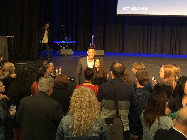 Folau mobbed by supporters the conference. Picture: Brenden Hills.