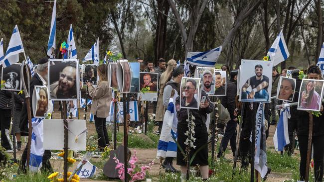 People visit the site of the Supernova music festival near Kibbutz Reim, southern Israel, where 364 people were killed by Hamas militants in the October 7 attacks.