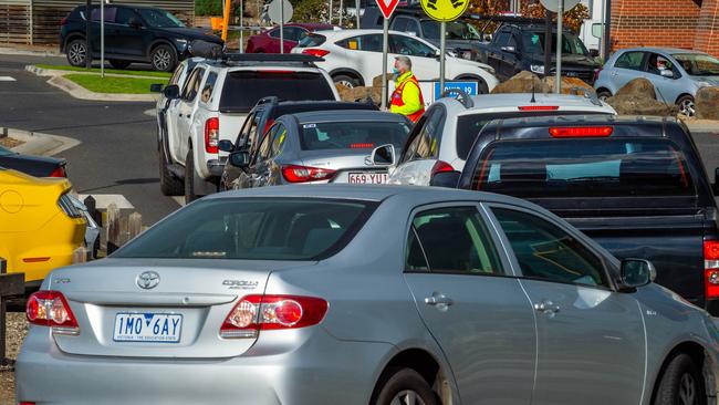 Cars queuing at the Northern Health testing centre in Epping on Tuesday morning. Picture: Jake Nowakowski