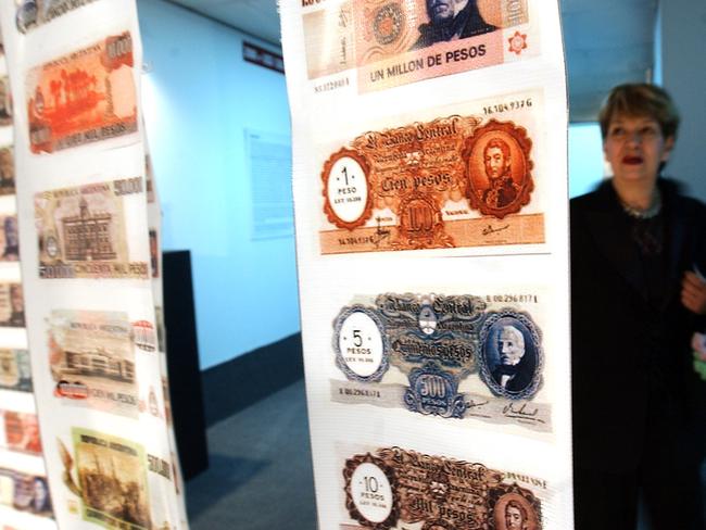 A woman looks at old currency in the Foreign Debt Museum in Buenos Aires, Argentina.