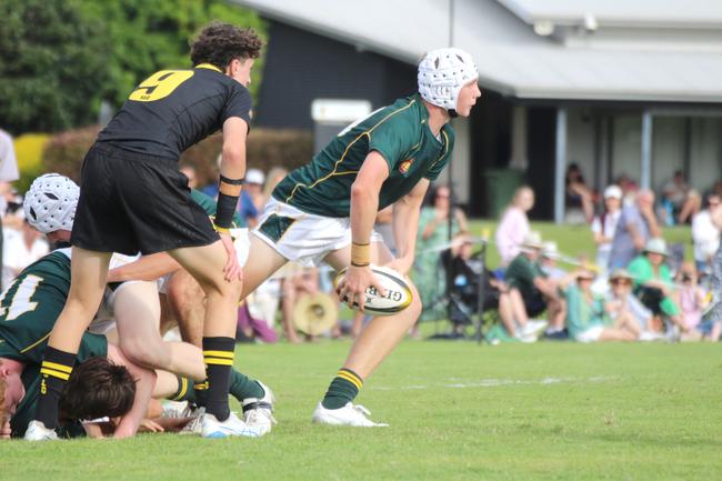 Flyhalf Lachie Francis gets the ball away from scrumhalf.