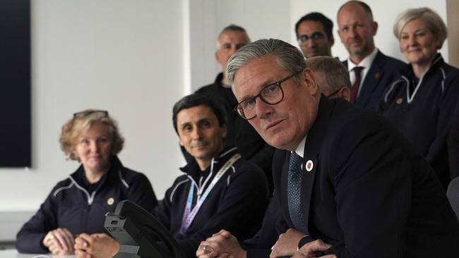 Britain's Prime Minister Keir Starmer speaks on the phone to US President Donald Trump at a car factory in the West Midlands, Thursday, May 8, 2025 as they eke out a trade deal. Picture: Alberto Pezzali/Pool/AP