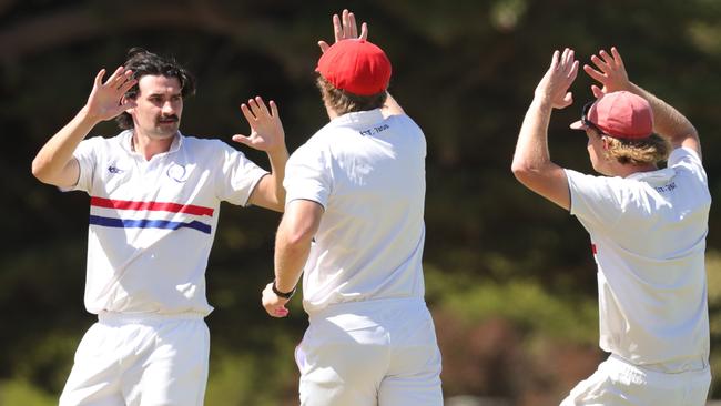 Queenscliff’s Ned Stephens celebrates the wicket of Barrabool’s Kane Pickering. Picture: Mark Wilson