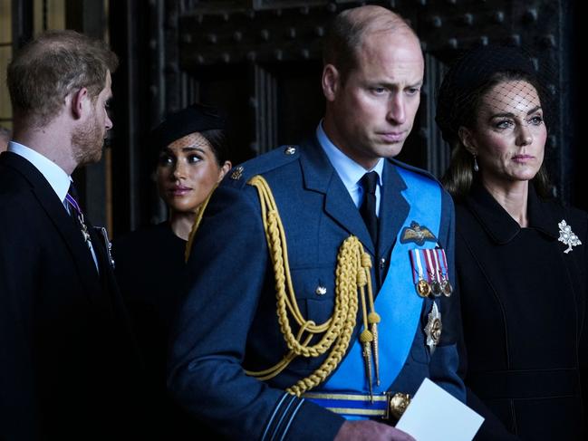 Britain's Prince Harry, Duke of Sussex, Meghan, Duchess of Sussex, Britain's Prince William, Prince of Wales and Britain's Catherine, Princess of Wales leave after a service for the reception of Queen Elizabeth II's coffin at Westminster Hall, in the Palace of Westminster in London on September 14, 2022, where the coffin will Lie in State. - Queen Elizabeth II will lie in state in Westminster Hall inside the Palace of Westminster, from Wednesday until a few hours before her funeral on Monday, with huge queues expected to file past her coffin to pay their respects. (Photo by Emilio Morenatti / POOL / AFP)