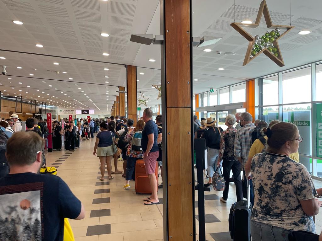 Long lines at security screening at Hobart Airport on Sunday.