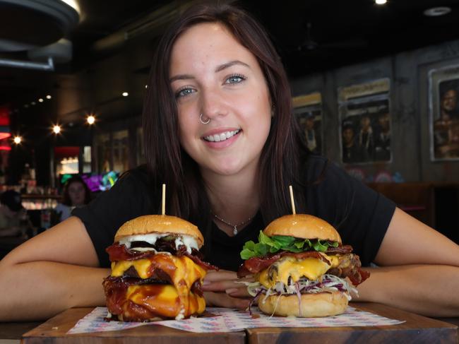 Milky Lane’s burgers are all named after famous rappers. Bartender Hayley Yaworski with some burgers. . Picture Glenn Hampson