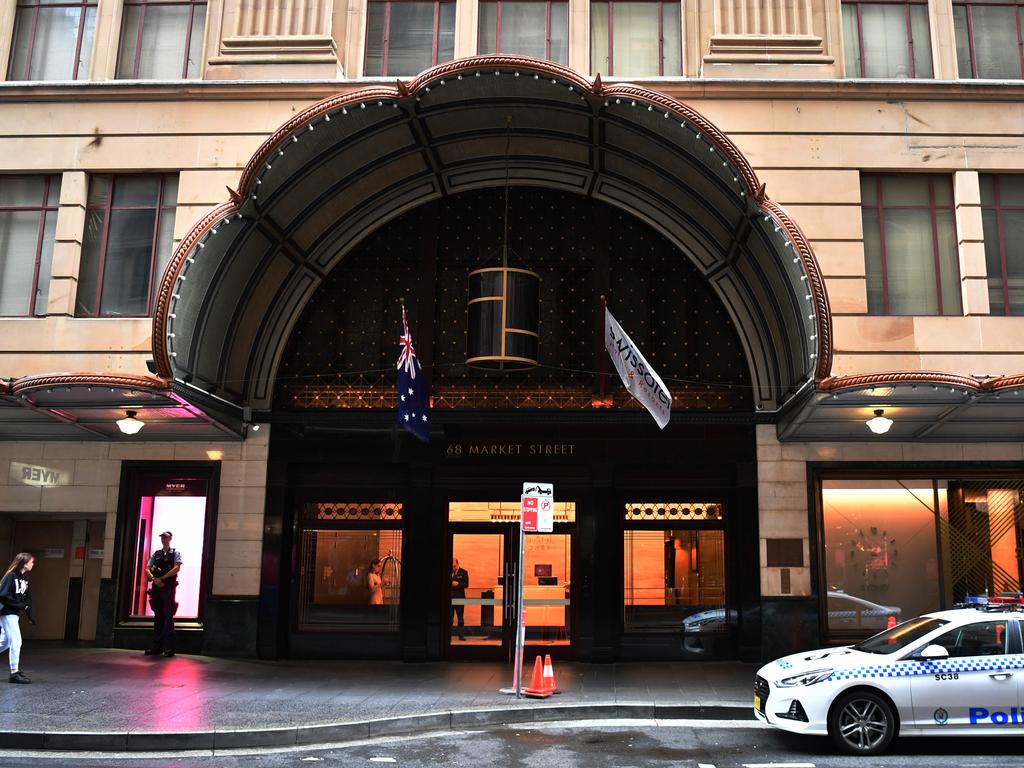 NSW Police stand guard outside the Swissotel Hotel in Market Street, Sydney. Picture: Dean Lewins/AAP