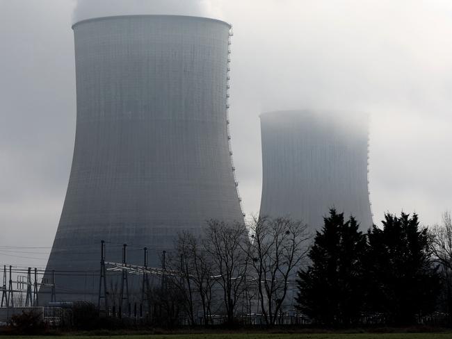 This photograph shows two cooling towers of the Civaux nuclear power plant in Civaux, central France, on December 15, 2024. (Photo by ROMAIN PERROCHEAU / AFP)