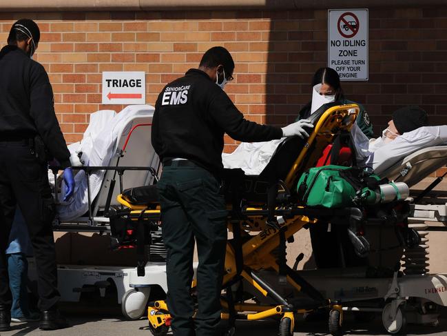 NEW YORK, NY - APRIL 16: Medical workers work with numerous patients outside of a special coronavirus intake area at Maimonides Medical Center on April 16, 2020 in the Borough Park neighborhood of the Brooklyn borough of New York City. Hospitals in New York City, which have been especially hard hit by the coronavirus, are still struggling with an influx of COVID-19 cases.   Spencer Platt/Getty Images/AFP == FOR NEWSPAPERS, INTERNET, TELCOS & TELEVISION USE ONLY ==