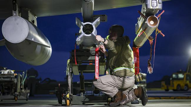 An RAF weapon technicians prepares a Typhoon FRG4 aircraft for strikes against Houthi military targets in Yemen at RAF Akrotiri in Cyprus. Picture: Getty Images