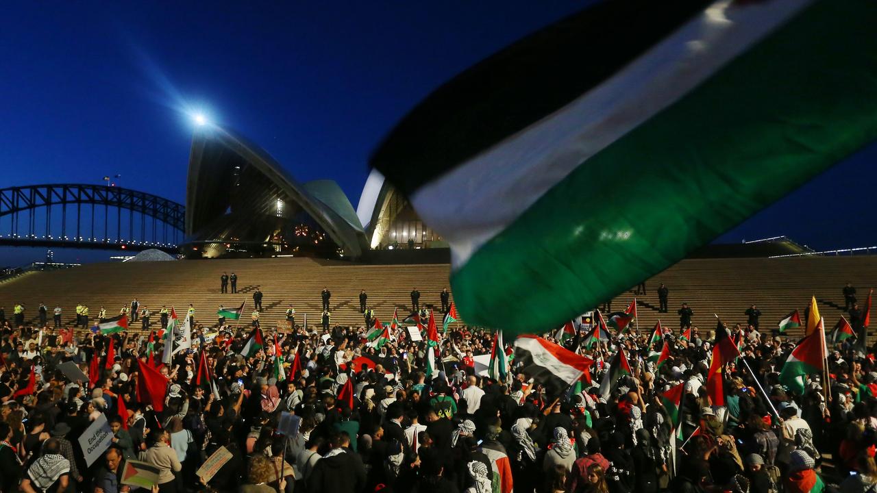 Palestine supporters rally outside the Sydney Opera House. Picture: Lisa Maree Williams/Getty Images