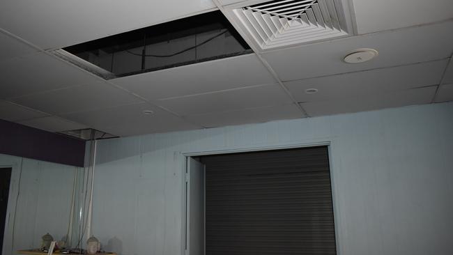 Mr Cooper believes the culprits accessed the building through this removed ceiling panel. Picture: Lillian Watkins