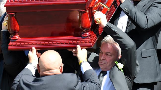 Borce Ristevski carries his wife’s coffin. Picture: Nicole Garmston