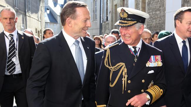 06/06/2014 BAYEUX- Australian Prime Minister Tony Abbott with Charles, Prince of Wales, and British Prime Minister David Cameron in Normandy, France. The three are walking with War Veterans