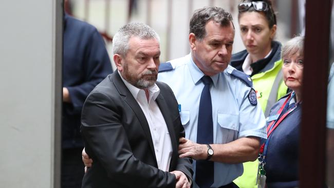 Borce Ristevski arrives from a prison van to the Supreme court in Melbourne. Picture: David Crosling