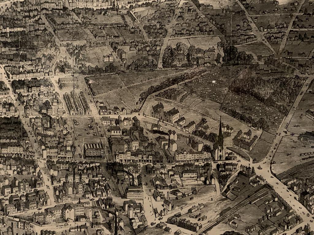 In the picture, the cemetery is visible to the centre right of the image with George St running horizontally.