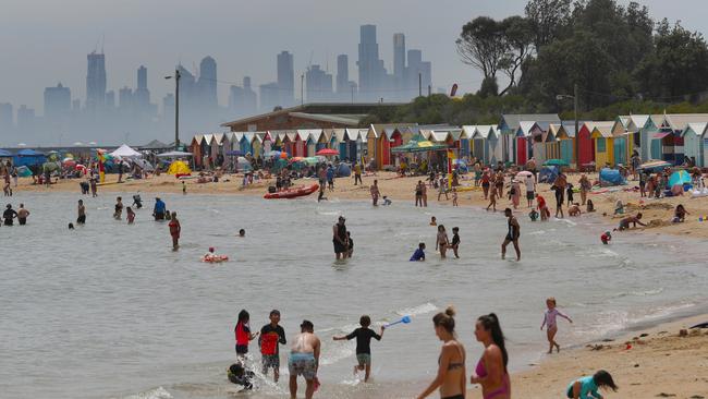 People flock to Brighton beach on Sunday as the heatwave swept across Victoria. Picture: David Crosling