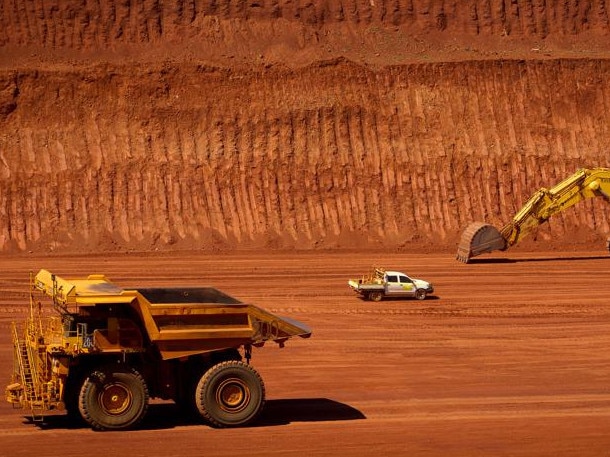 FILE PHOTO: Machinery operates in a pit at Rio Tinto Group's West Angelas iron ore mine in Pilbara, Australia, on Sunday, Feb. 19, 2012. Rio Tinto Group said Chief Executive Officer Tom Albanese will step down, after announcing a surprise $14 billion impairment. Sam Walsh, head of the iron-ore division, has been appointed as his successor with effect from today, the company said in a statement. Photographer: Ian Waldie/Bloomberg via Getty Images