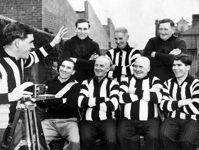 Lou Richards as Collingwood captain in 1951 takes a photo of (from left back) Stan Vandersluys, Albert Pannam, Horrie Jenkins and (front) Alby Pannam, Charlie Pannam, Charles Pannam and Ron Richards.