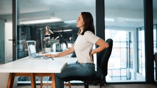 Sitting with poor posture in a non-ergonomic chair can also cause our spinal discs to compress, triggering pretty severe pain.  Image: iStock