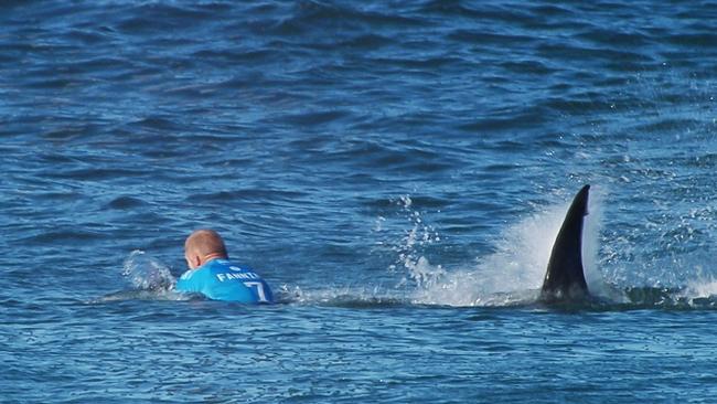 Mick Flanning is pursued by a shark, in Jeffrey's Bay, South Africa