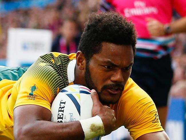 BIRMINGHAM, ENGLAND - SEPTEMBER 27: Henry Speight of Australia dives in to score their fourth try during the 2015 Rugby World Cup Pool A match between Australia and Uruguay at Villa Park on September 27, 2015 in Birmingham, United Kingdom. (Photo by Dan Mullan/Getty Images)