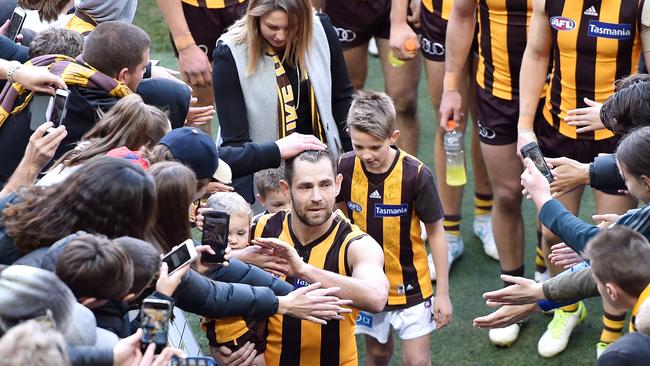 Who wouldn’t want a piece of the Hawks legend after his 300th. Picture: Jake Nowakowski