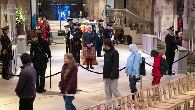 Mourners file past as Charles (centre) holds vigil. Picture: Jane Barlow - WPA Pool/Getty