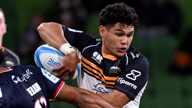 Brumbies' Noah Lolesio (R) is tackled by the Rebels' David Feliuai (L) during the Super Rugby match between the Melbourne Rebels and the ACT Brumbies in Melbourne on February 23, 2024. (Photo by William WEST / AFP) / -- IMAGE RESTRICTED TO EDITORIAL USE - STRICTLY NO COMMERCIAL USE --