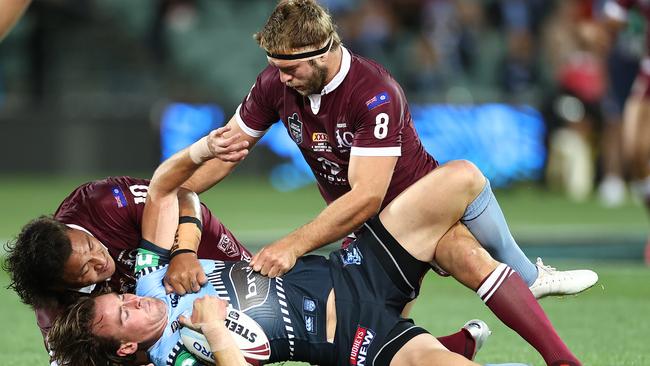 ADELAIDE, AUSTRALIA – NOVEMBER 04: Clint Gutherson of the Blues is tackled during game one of the 2020 State of Origin series between the Queensland Maroons and the New South Wales Blues at the Adelaide Oval on November 04, 2020 in Adelaide, Australia. (Photo by Cameron Spencer/Getty Images)