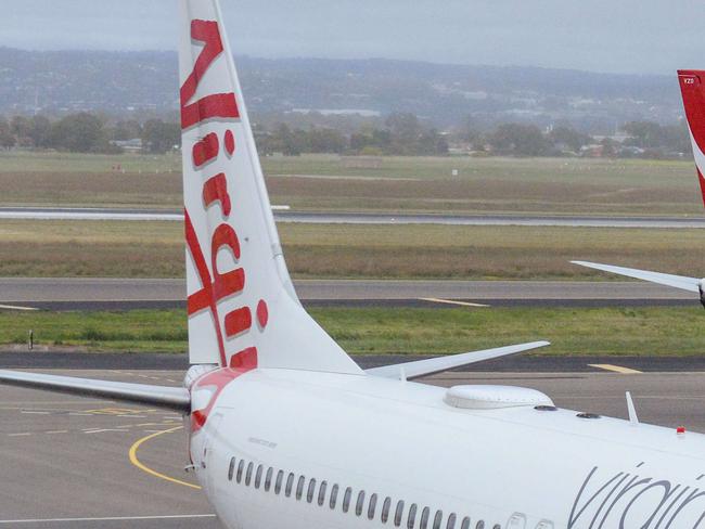 ADELAIDE, AUSTRALIA - NewsWire Photos SEPTEMBER 22, 2021: Virgin, Qantas and Cobham aircraft at Adelaide Airport. Picture: NCA NewsWire /Brenton Edwards