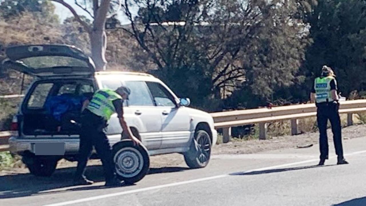 Police major crash investigators at the scene of an accident where a person was changing a tyre on the side of the Port Expressway at Wingfield when they were hit by a car. Picture: George Yankovich