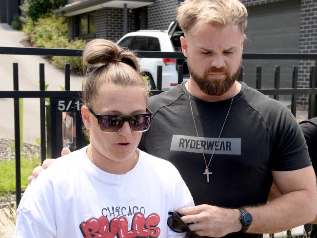 Natalie Gordon, with her partner, Hayden Cook, outside Ash Gordon’s Doncaster home. Picture: Andrew Henshaw