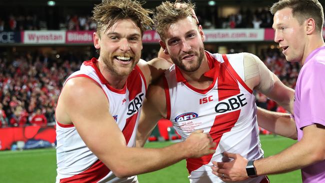 Alex Johnson and Dane Rampe celebrate the win and Johnson’s successful return. Picture: Phil Hillyard