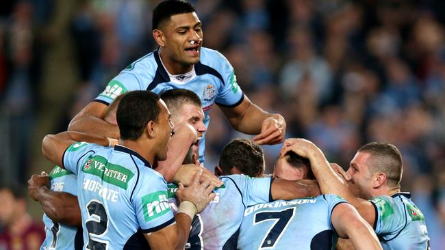 NSW's Trent Hodkinson celebrates scoring a try with team mates during Game 2 of the 2014 State of Origin series at ANZ Stadium