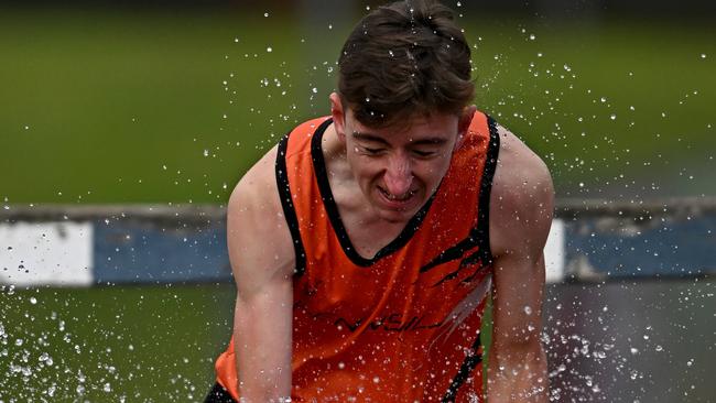 Zachery Dyer competes in the 3000m steeplechase. Picture: Andy Brownbill