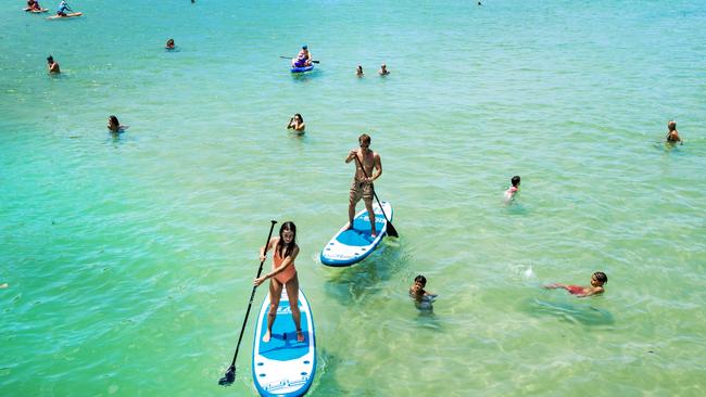 Paddleboarding is popular at Tallebudgera Creek. Picture: Nigel Hallett