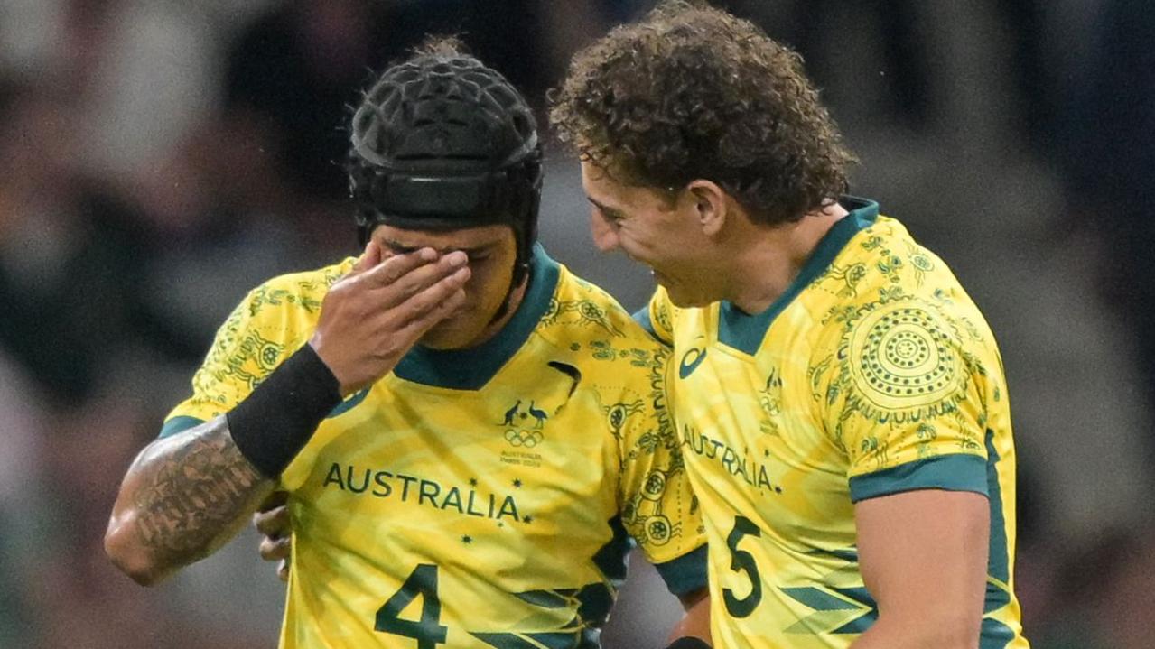 Australia's Dietrich Roache (L) and Australia's Mark Nawaqanitawase (R) after their quarter-final win.