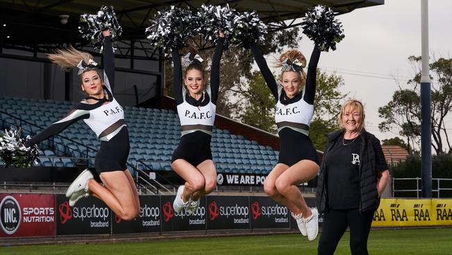 Magpies cheerleaders Gabriella Ward, Abbey Harby and Zenya Lodenstein with choreographer Gaynor Palmer. Picture: Matt Loxton