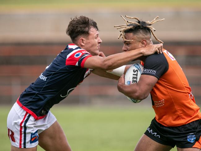 Xavier Tauaifaiga tries to break free. Picture: Julian Andrews