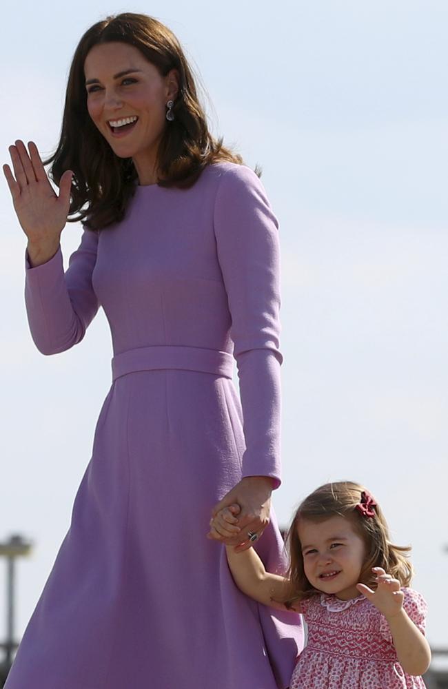 Britain's Kate, the Duchess of Cambridge boards a plane with her daughter Princess Charlotte in Hamburg, Germany. Picture: AP